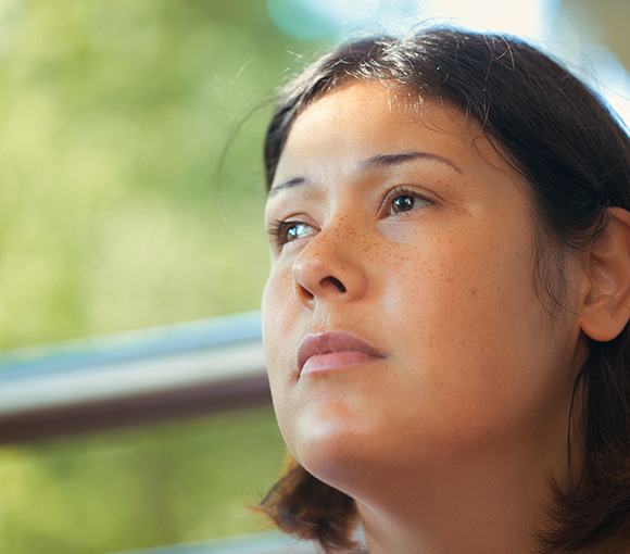 thoughtful woman looking upward with natural background reflecting introspection and tranquility 2 insights 2 moments